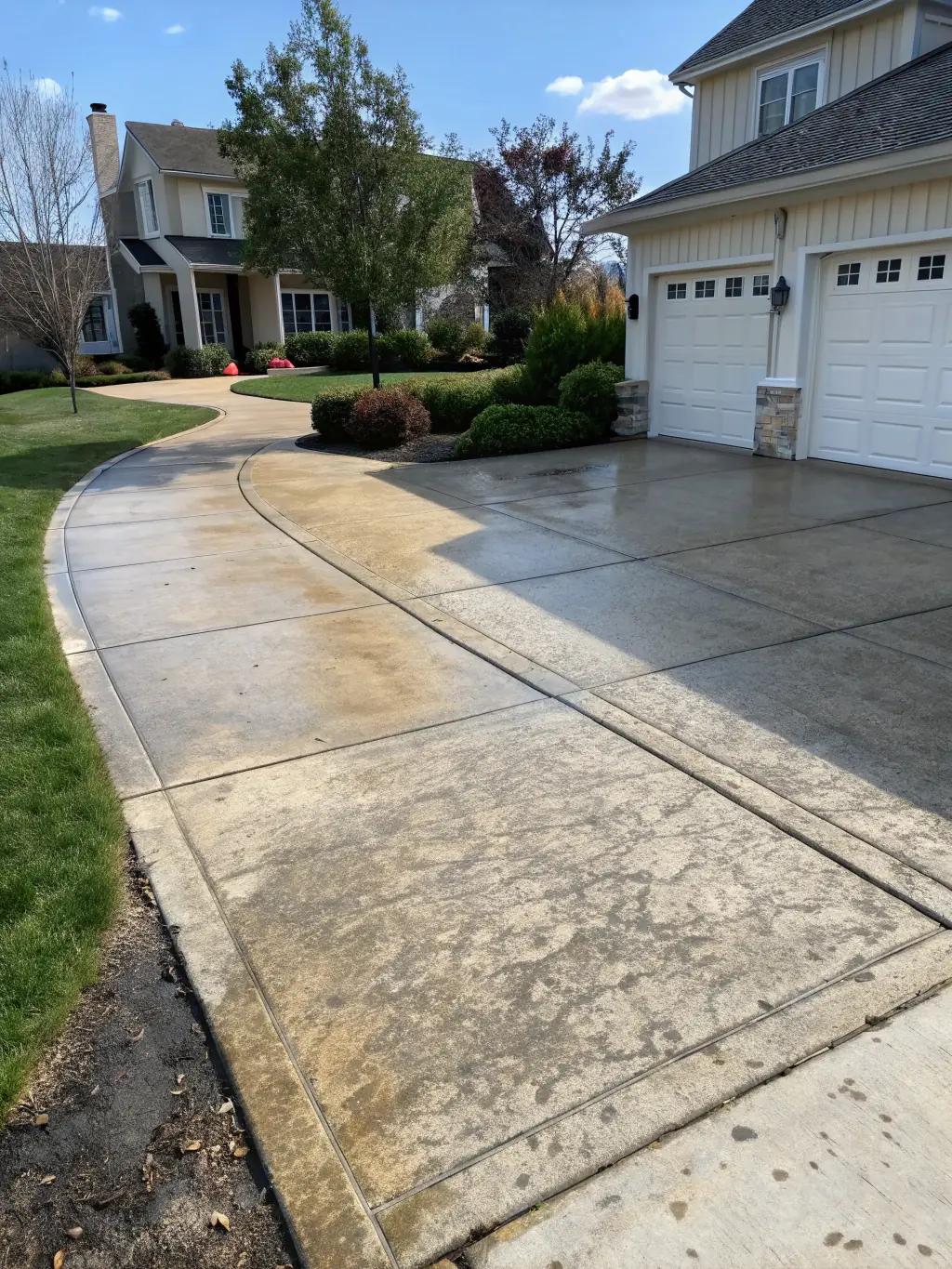A before-and-after image showcasing the transformation of a dirty house exterior to a sparkling clean surface after On Point Pressure Cleaning's service.